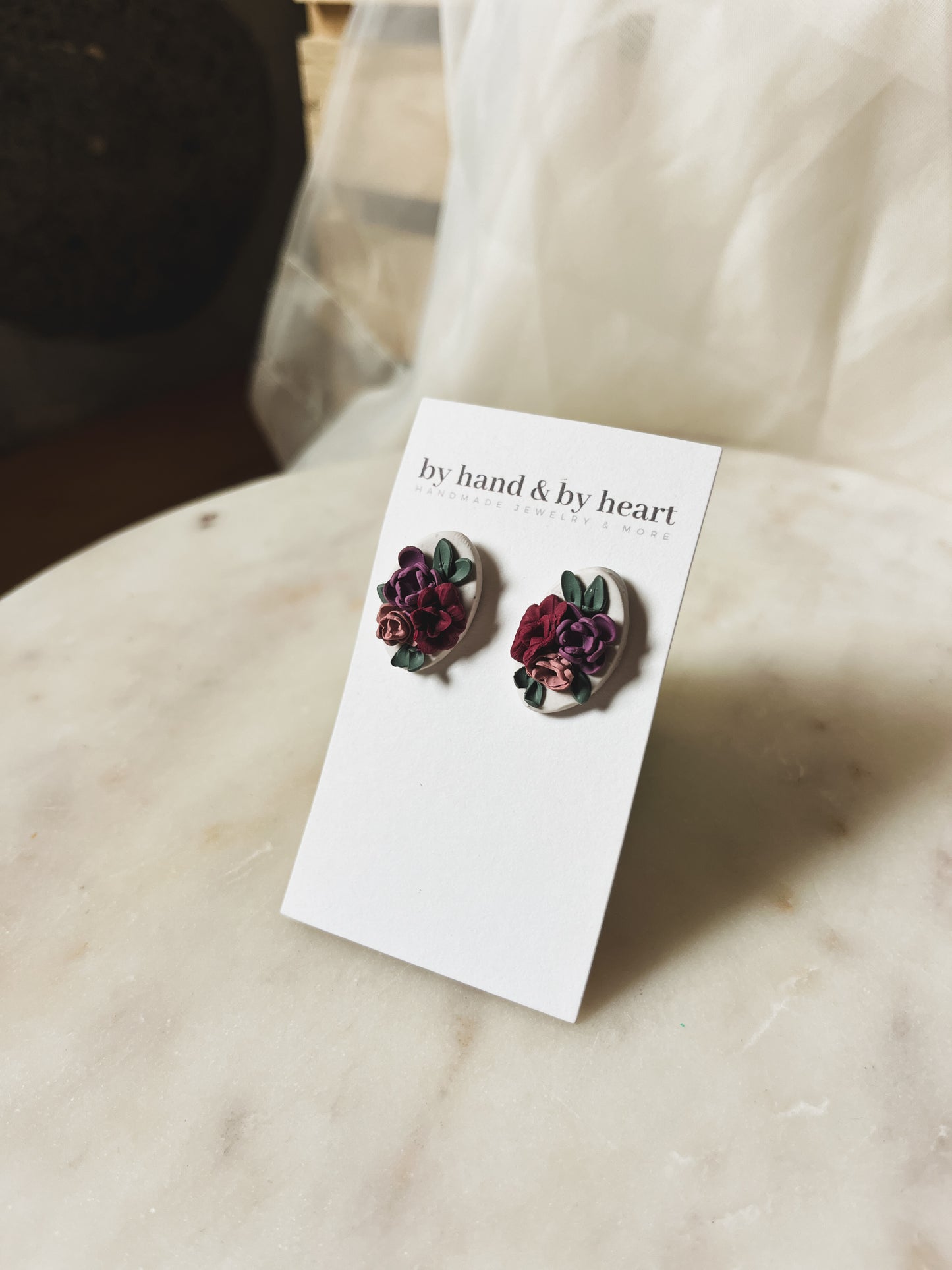 CREAM FLORAL STUDS