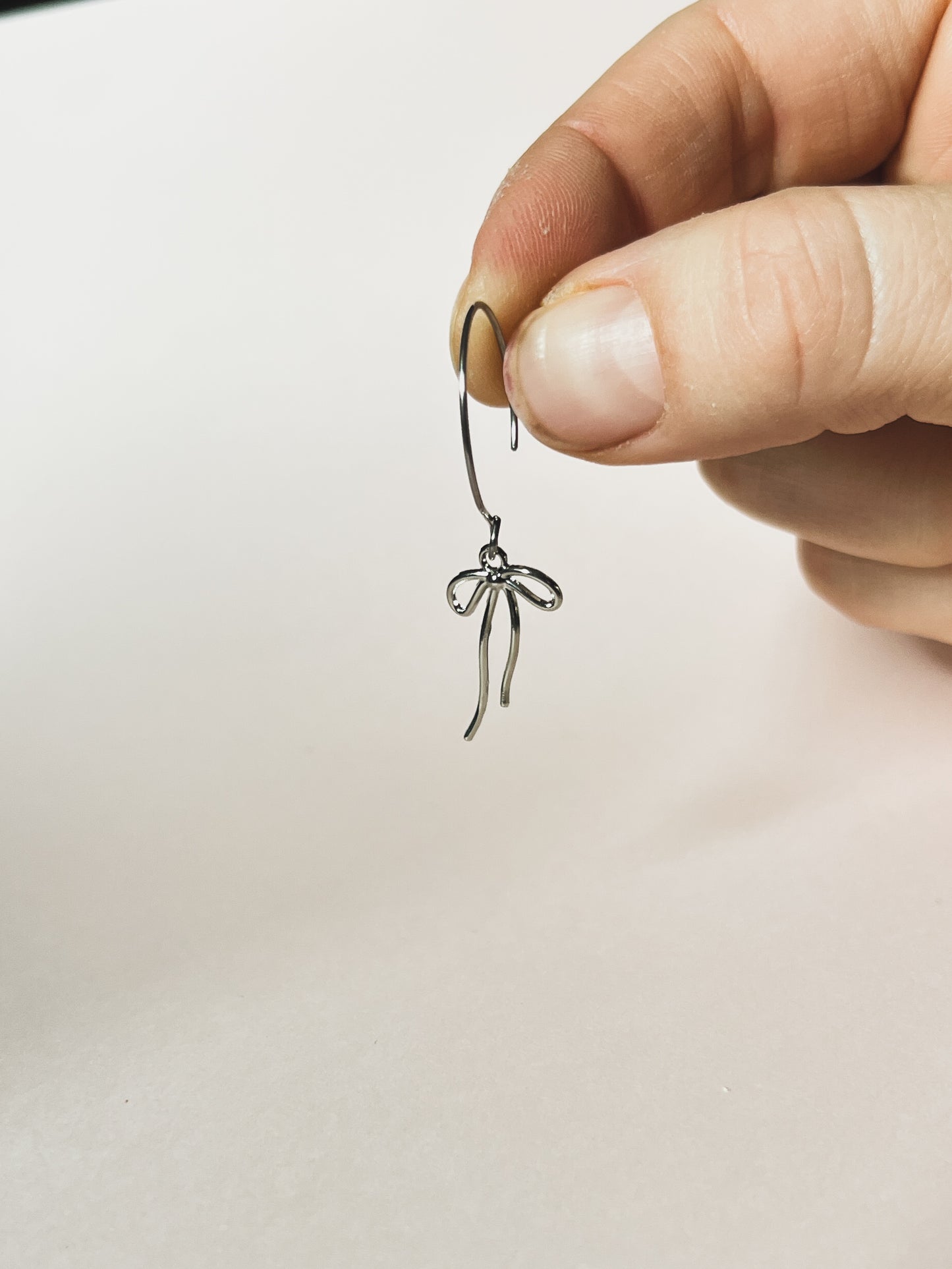 SILVER TINY BOW HOOPS