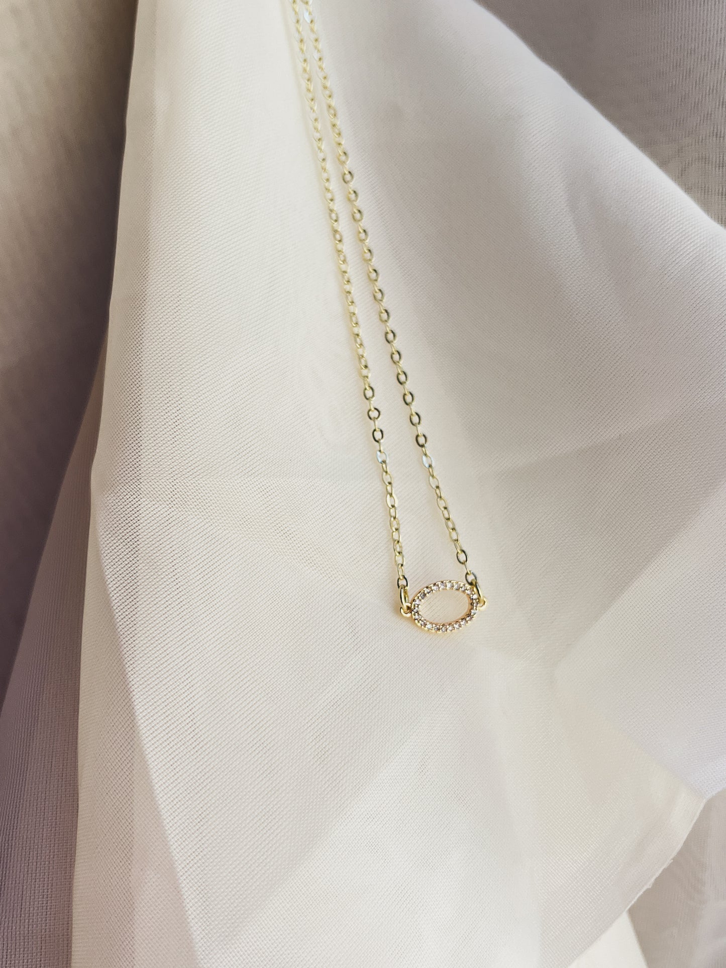 DAINTY CZ OVAL NECKLACE in gold